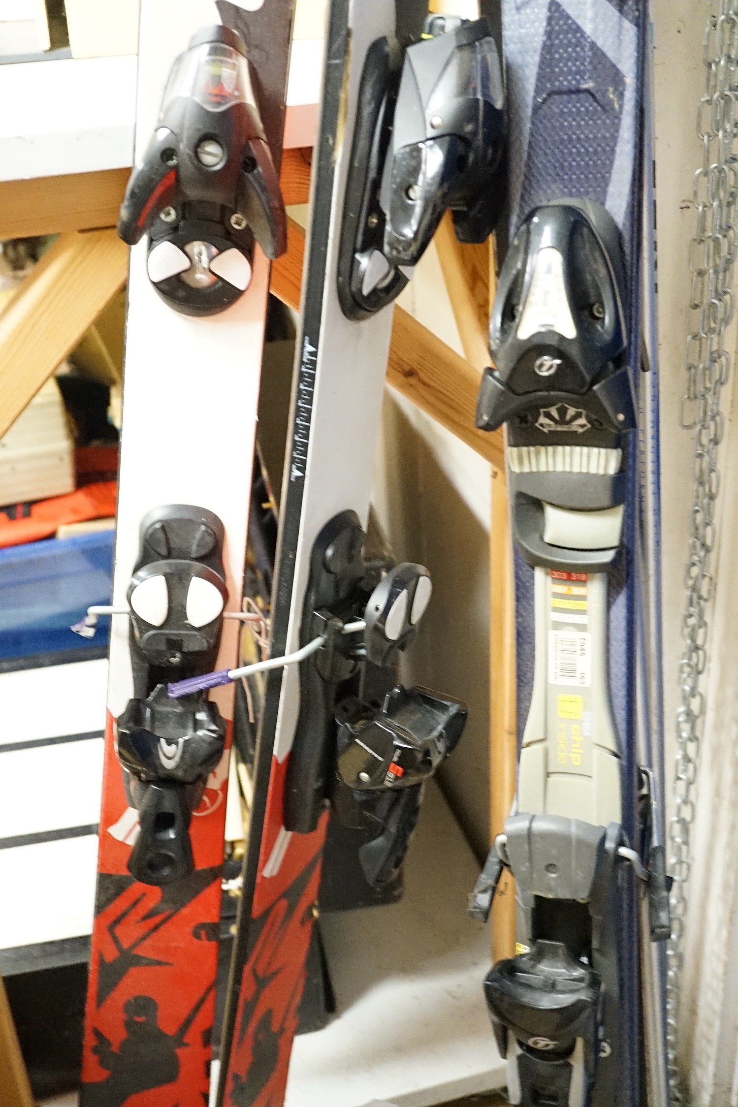 A pair of K2 skis, a pair of Head intelligence skis and a pair of Lexi ski poles